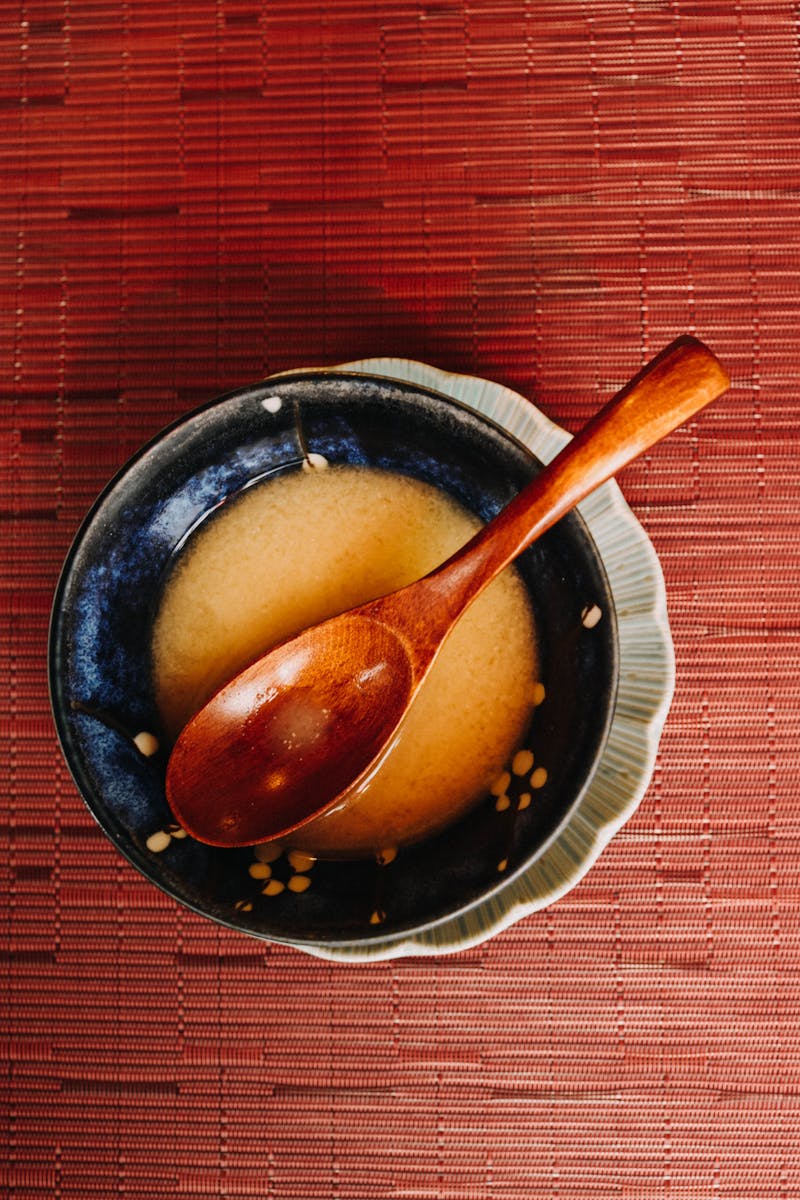 Traditional Japanese miso soup with wooden spoon